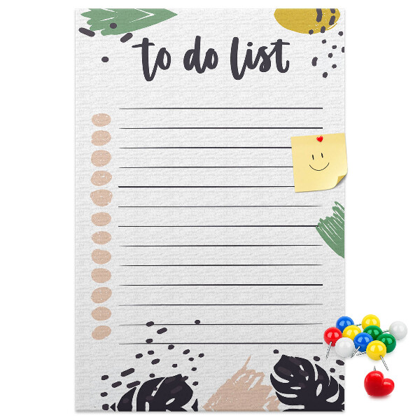 Kurken prikbord met een print van kleurrijke bladeren op een takenlijst