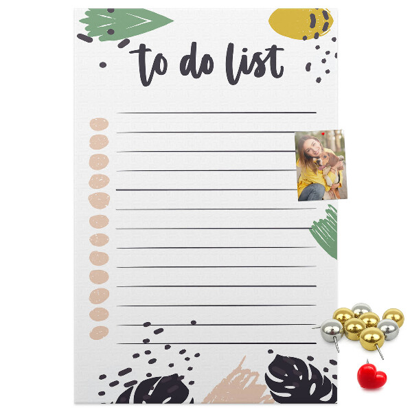 Kurken prikbord met een print van kleurrijke bladeren op een takenlijst