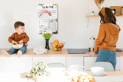 Kurken prikbord met een print van kleurrijke bladeren op een takenlijst