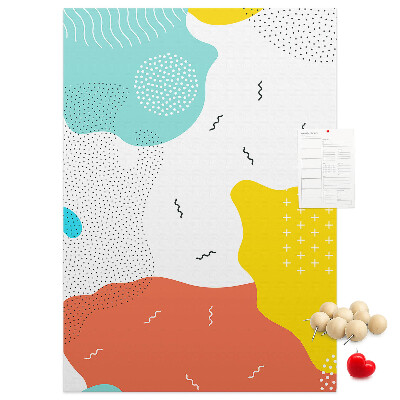 Kurken memobord met kleurrijke abstracte vormen en patronen