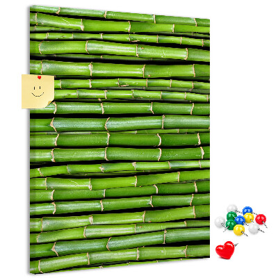 Kurken memobord met decoratieve groene bamboestengels