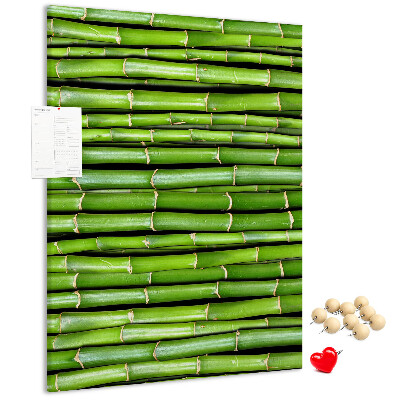 Kurken memobord met decoratieve groene bamboestengels