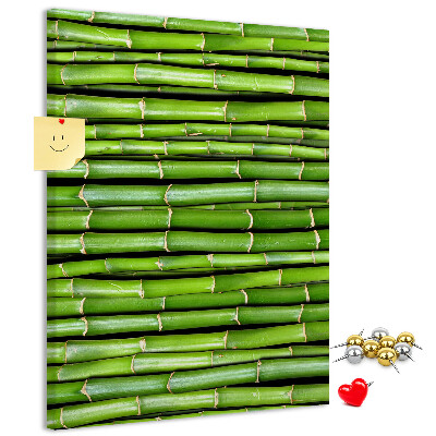 Kurken memobord met decoratieve groene bamboestengels