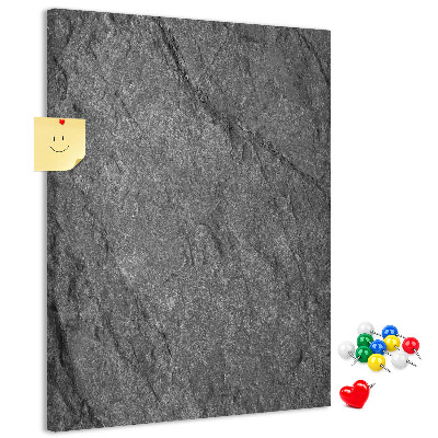 Prikbord van kurk met grijszwarte natuursteenstructuur