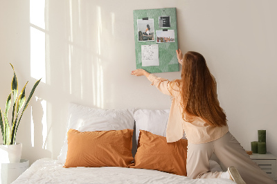 Prikbord van kurk met geometrische vormen in groene tinten