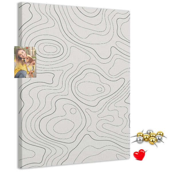 Memobord van kurk met abstracte lijnen en golven op de achtergrond