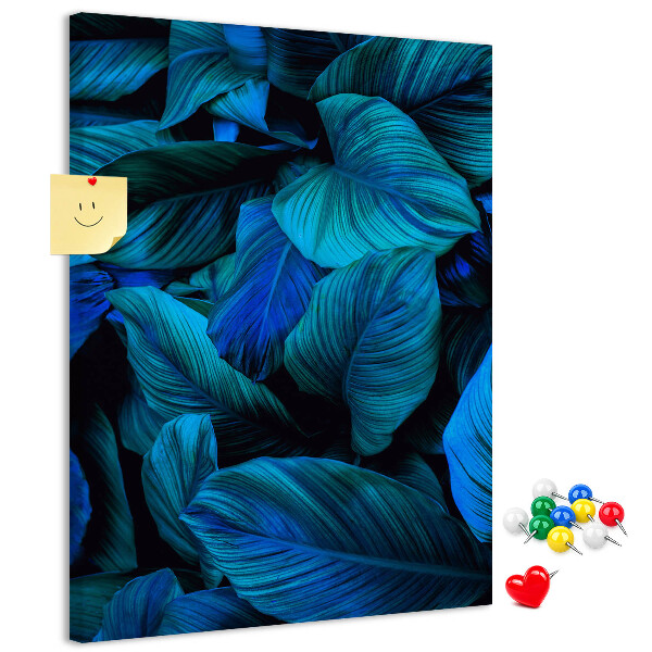 Memobord van kurk met nachtbladeren in verschillende tinten blauw
