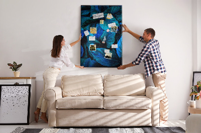 Memobord van kurk met nachtbladeren in verschillende tinten blauw