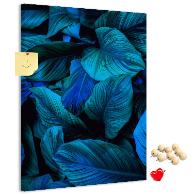Memobord van kurk met nachtbladeren in verschillende tinten blauw