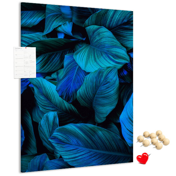 Memobord van kurk met nachtbladeren in verschillende tinten blauw