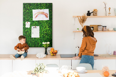 Kurk memobord met decoratieve groene bladeren