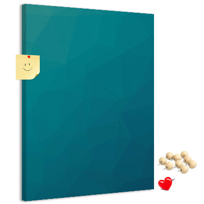Kurken prikbord met geometrische blauwtinten op de achtergrond