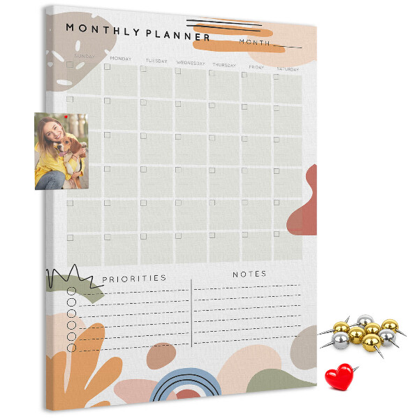 Kurken memobord maandplanner met kleurrijke abstracte vormen