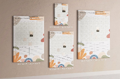Kurken memobord maandplanner met kleurrijke abstracte vormen