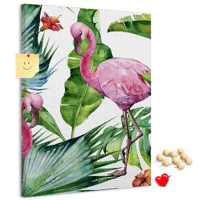 Prikbord van kurk met vrolijke flamingo's in een tropische omgeving