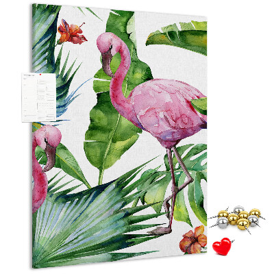 Prikbord van kurk met vrolijke flamingo's in een tropische omgeving