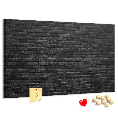 Kurkbord close-up van een donkere gestructureerde bakstenen muur