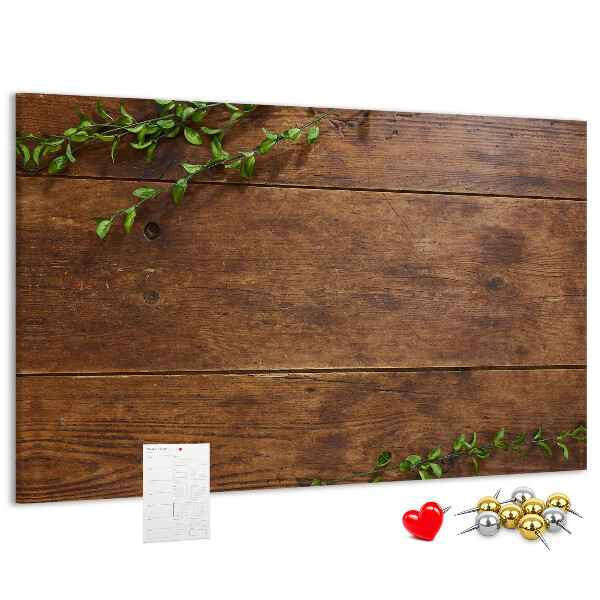 Prikbord natuurlijk hout met groene takken