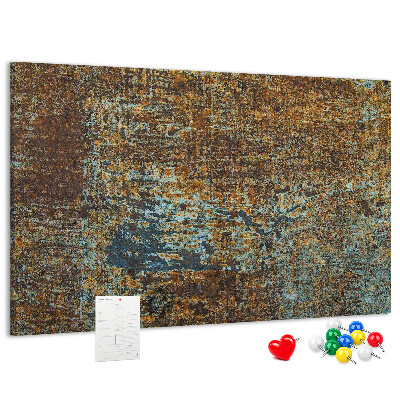 Prikbord met roestig oppervlak en blauwe accenten