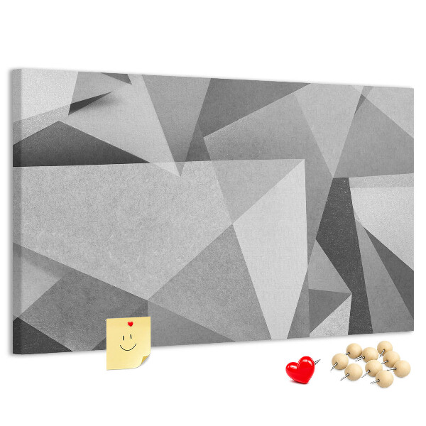 Prikbord met abstracte grijze en zwarte geometrische vormen