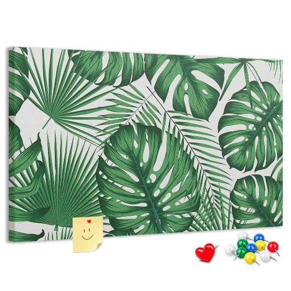 Prikbord met talrijke bladeren van tropische planten in het groen