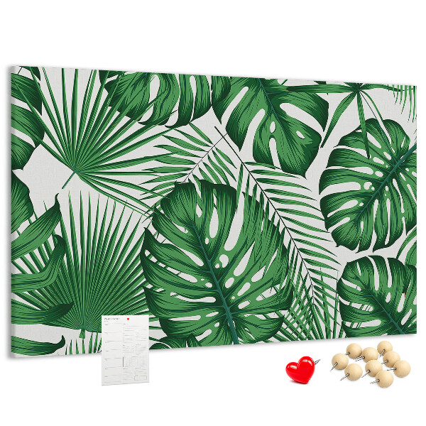 Prikbord met talrijke bladeren van tropische planten in het groen