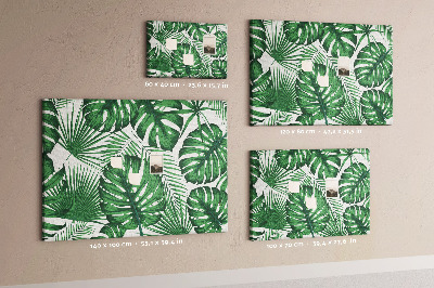 Prikbord met talrijke bladeren van tropische planten in het groen