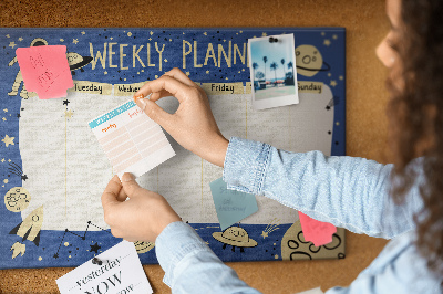 Kurkbord kosmische weekplanner met planeten en sterren