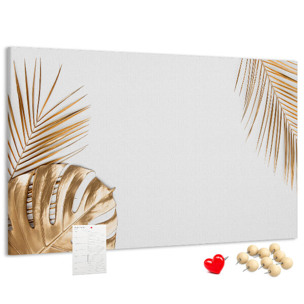 Prikbord met gouden bladeren op een witte achtergrond