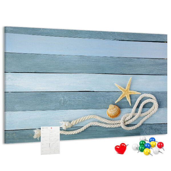 Prikbord met afbeelding van zeegezicht met schelpen en touw