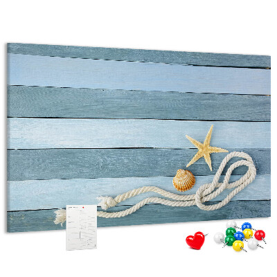Prikbord met afbeelding van zeegezicht met schelpen en touw
