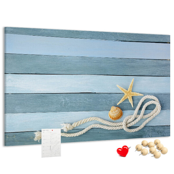 Prikbord met afbeelding van zeegezicht met schelpen en touw