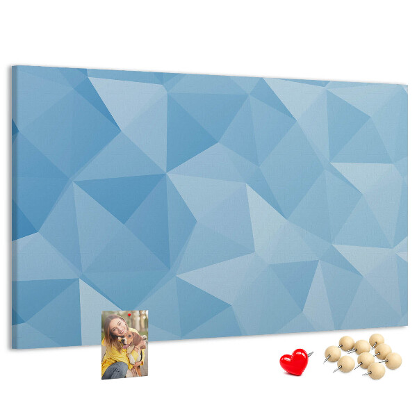 Prikbord met geometrische blauwe driehoeken in verschillende tinten