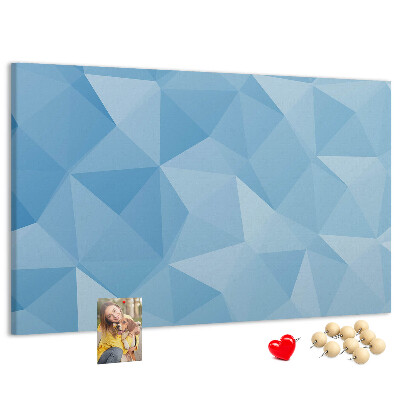 Prikbord met geometrische blauwe driehoeken in verschillende tinten