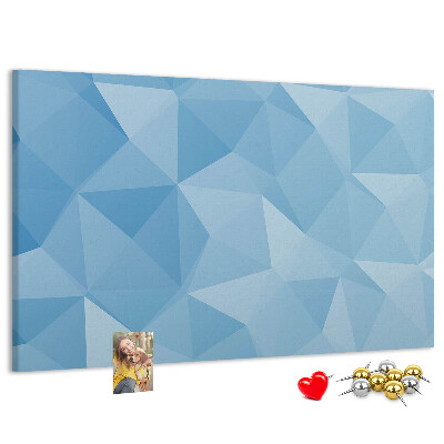 Prikbord met geometrische blauwe driehoeken in verschillende tinten