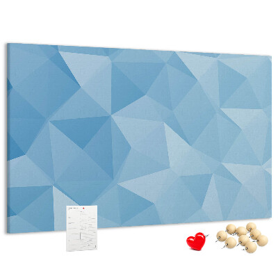 Prikbord met geometrische blauwe driehoeken in verschillende tinten