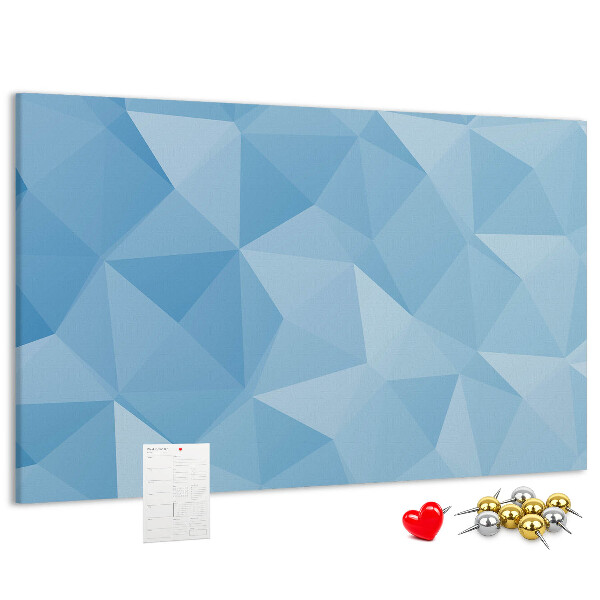Prikbord met geometrische blauwe driehoeken in verschillende tinten