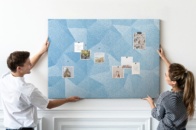 Prikbord met geometrische blauwe driehoeken in verschillende tinten