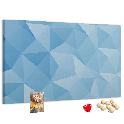 Prikbord met geometrische blauwe driehoeken in verschillende tinten
