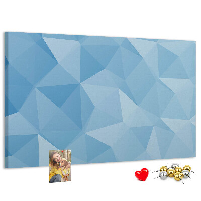 Prikbord met geometrische blauwe driehoeken in verschillende tinten