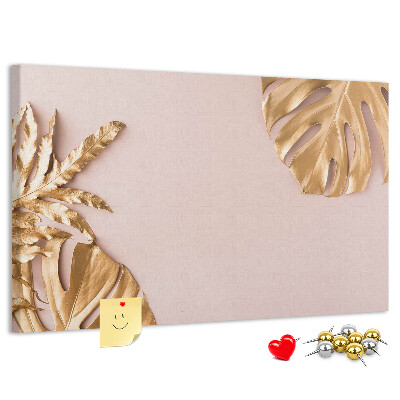 Prikbord met gouden bladeren op een delicate achtergrond