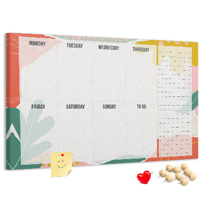 Kurkbord met bloemenkalender en kleurrijke accenten