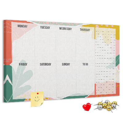 Kurkbord met bloemenkalender en kleurrijke accenten