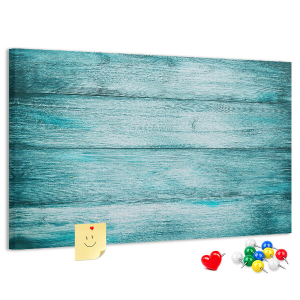 Kurkbord met achtergrond van groene en blauwe houten planken