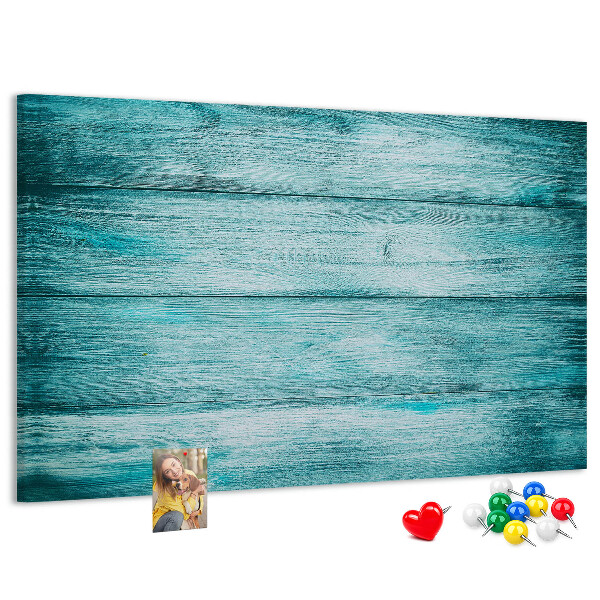 Kurkbord met achtergrond van groene en blauwe houten planken