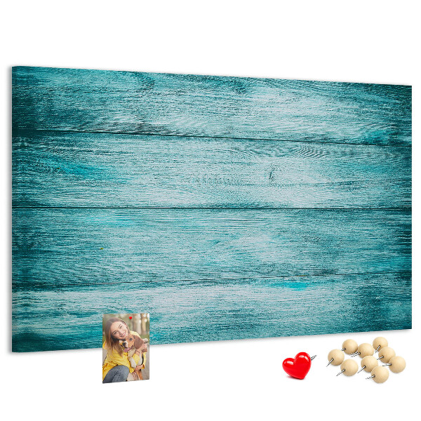 Kurkbord met achtergrond van groene en blauwe houten planken