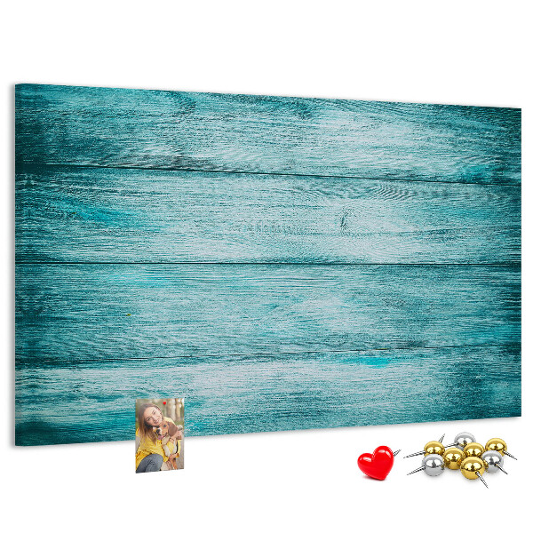 Kurkbord met achtergrond van groene en blauwe houten planken