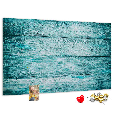Kurkbord met achtergrond van groene en blauwe houten planken