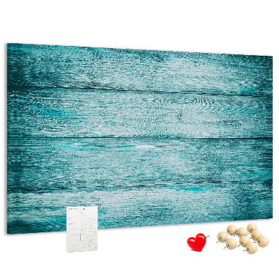 Kurkbord met achtergrond van groene en blauwe houten planken