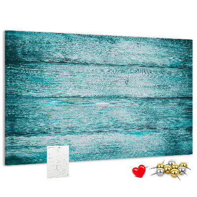 Kurkbord met achtergrond van groene en blauwe houten planken